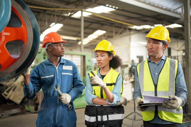 istock Three Diverse Multicultural Heavy Industry Engineers and Workers in Uniform at Steel Factory. 1410137917