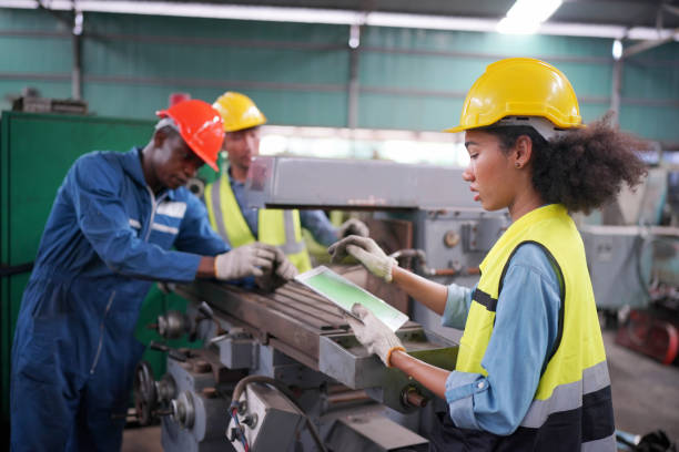 istock Three Diverse Multicultural Heavy Industry Engineers and Workers in Uniform at Steel Factory. 1410137918