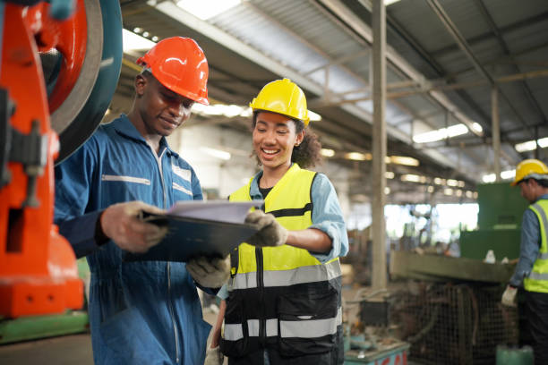 istock Three Diverse Multicultural Heavy Industry Engineers and Workers in Uniform at Steel Factory. 1410137922