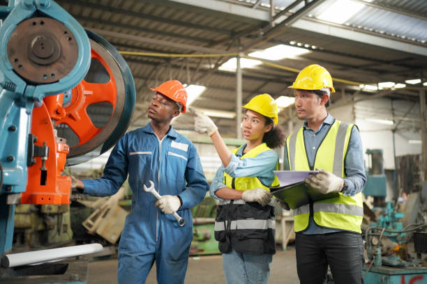 istock Three Diverse Multicultural Heavy Industry Engineers and Workers in Uniform at Steel Factory. 1410137926