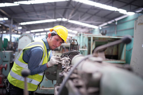istock mechanics engineer operating lathe machine for metalwork in metal work factory 1410138032