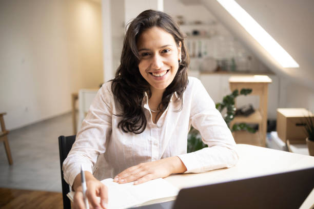 istock Portrait of a young freelancer working from her home office 1410138341