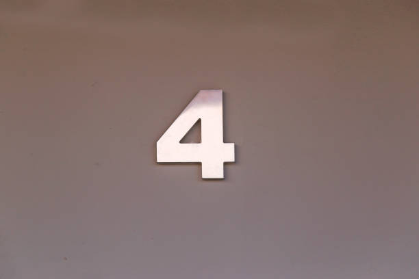 istock 4 metal number with copy space and gray tone - four 1410139208