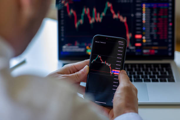 istock Businessman analyzing crypto currency market graphs 1410140346
