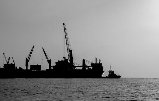 Silhouettes of port constructions image