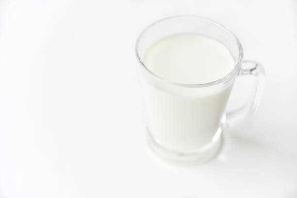 istock Glass transparent glass with milk on a white background. 1410141119
