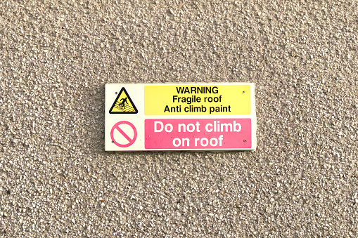 Do not climb on roof safety sign UK