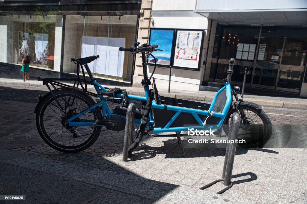Parked cargo bike Cargo bike in a big city street Cargo Bike Stock Photo