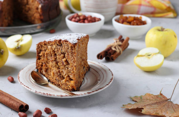 istock Homemade apple pie with cinnamon, raisins and peanuts, sprinkled with powdered sugar 1410146421