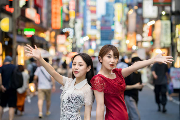 istock Two women posing in downtown 1410147688