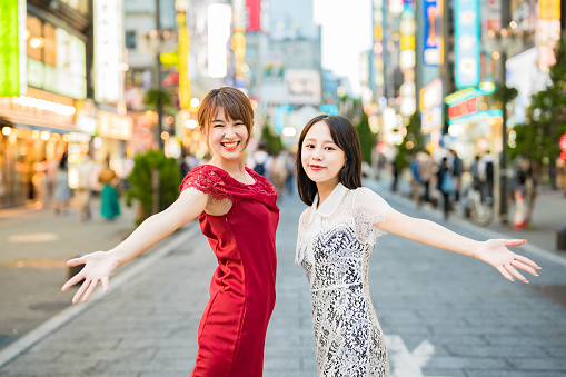 Two young women posing in downtown