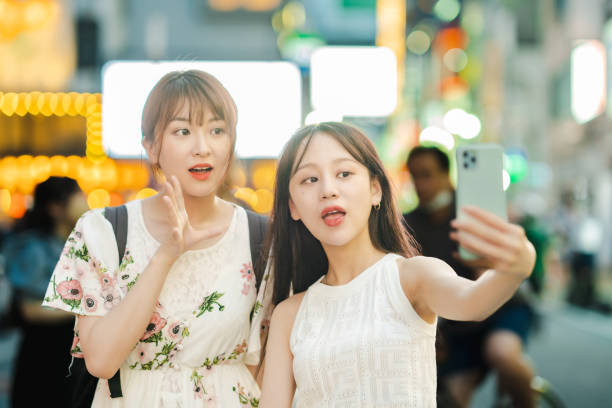 istock Women taking selfies in downtown 1410152641