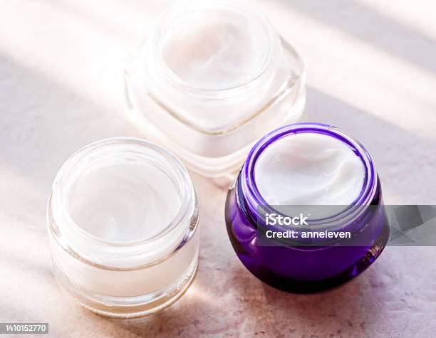 Moisturising Beauty Cream Jars Skincare And Spa Cosmetics On Stone Background In Summer At Sunset Cosmetic Product And Skin Care Stock Photo - Download Image Now