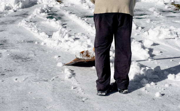 istock Man removing snow with a shovel 1410152833