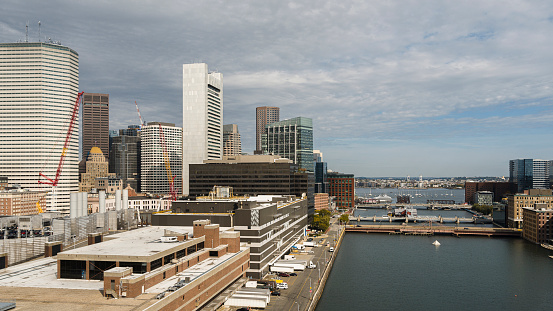 Boston's famous landmark - Tea Party Ships and Museum at Congress Street Bridge, with Summer Street bridge at the front, located on the Fort Point Channel. View of financial district of Boston, Massachusetts, USA.