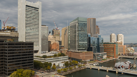 Boston's famous landmark - Tea Party Ships and Museum at Congress Street Bridge, with Summer Street bridge at the front, located on the Fort Point Channel. View of financial district of Boston, Massachusetts, USA.