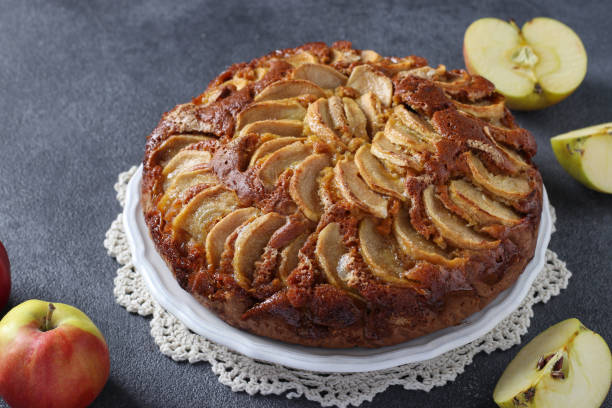 istock Homemade pie Charlotte with apples on dark gray background 1410154320