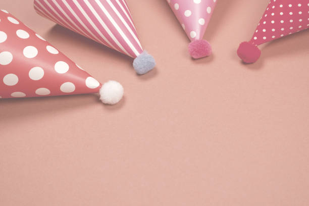 Colorful birthday cap on brown  background. Copy space.