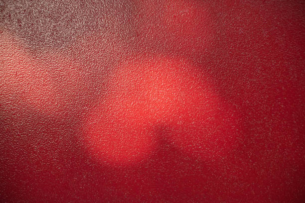 istock Red metal background. Light and shadow painted with red paint metal texture. 1410155773