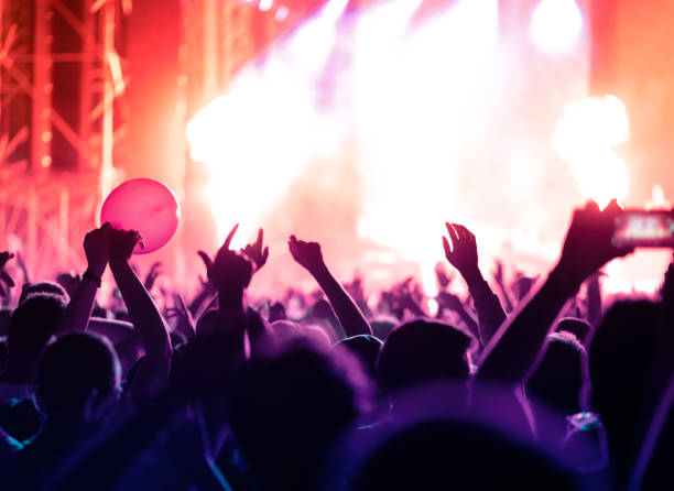 istock Music festival crowd with on stage fire 1410155807