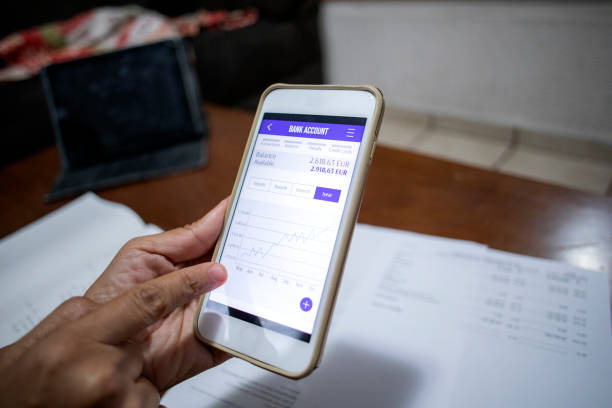 istock couple lgtb+ at home reviewing finances 1410155900