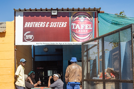 Bar at Katutura Township near Windhoek at Khomas Region, Namibia, with customers enjoying some refreshment.