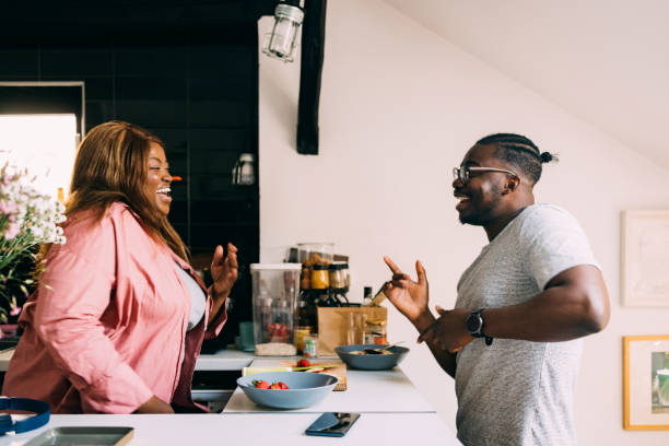 Couple Dancing In The Kitchen Young Afro-American Couple dancing in the kitchen. body positive couple stock pictures, royalty-free photos & images