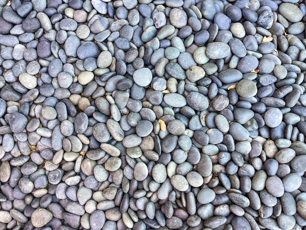 Background of river stones pile, beautiful smooth round stones stock photo