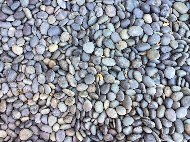 background of river stones pile, beautiful smooth round stones - seixo imagens e fotografias de stock