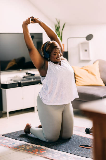 istock Woman Exercising At Home 1410159970