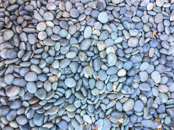 istock Background of river stones pile, beautiful smooth round stones 1410160253