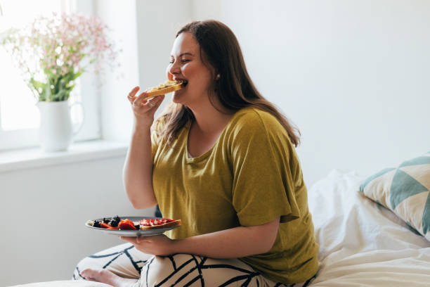 istock Woman Enjoying Her Breakfast 1410160544