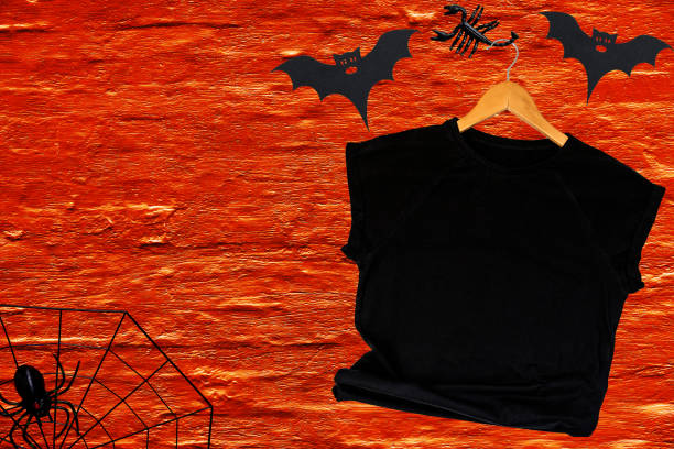 istock Blank Black t-shirt Mockup on orange background. 1410161259