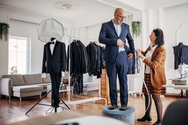 istock Tailor taking measurements for new suit 1410161319