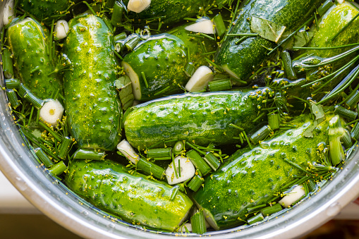 Top view of fresh marinated green cucumbers.