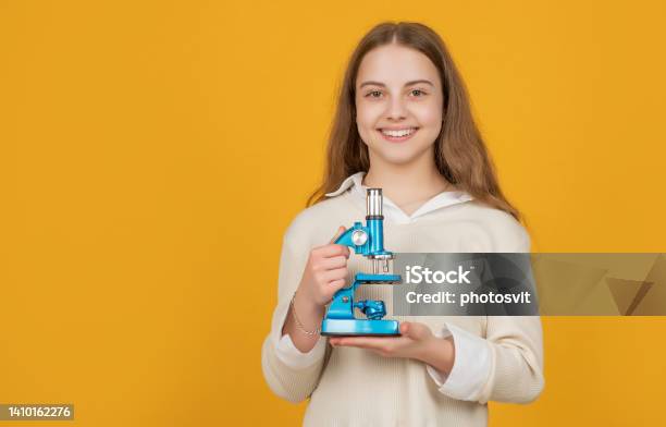 Cheerful Child With Microscope On Yellow Background Stock Photo - Download Image Now