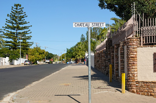 Chateau Street in Windhoek at Khomas Region, Namibia, with people and cars visible in the background.