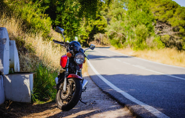 istock red retro  motorcycle on route N2 in portugal 1410169251