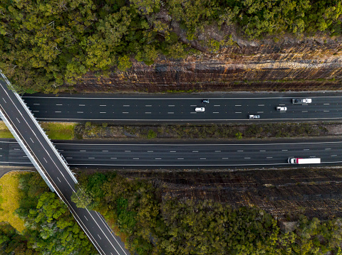 M1 Motorway and the Overpass of Pacific Highway at Cowan. Directly above view. Australia