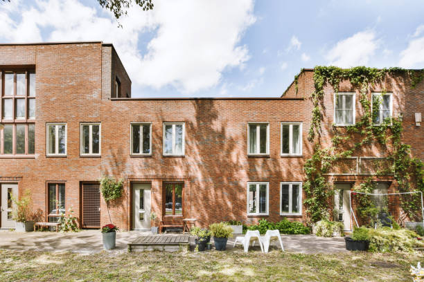 istock Facade of a residential brick house with doors and windows 1410182038