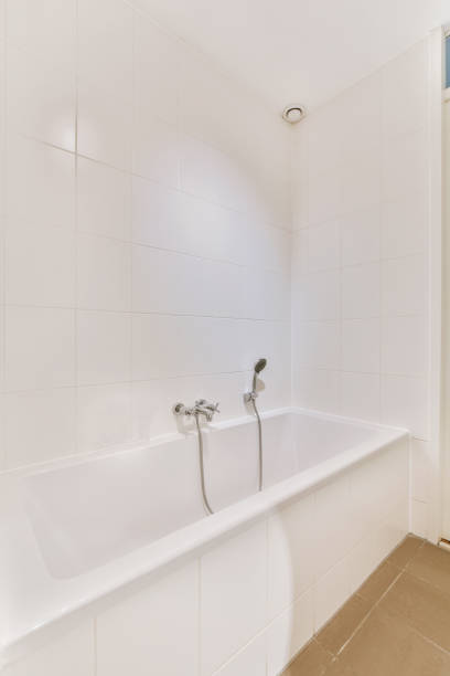 istock Bathroom in a cozy house decorated with white tiles 1410182073