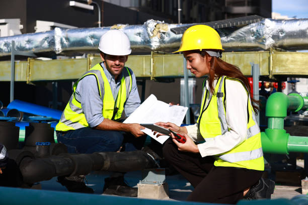 istock Project Engineer and technician team wearing safety vest and helmet concentrate discussing about job at Rooftop construction site line, Engineer team work together 1410182810