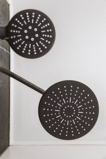 istock Modern spacious bathroom with white and black tiles 1410185736