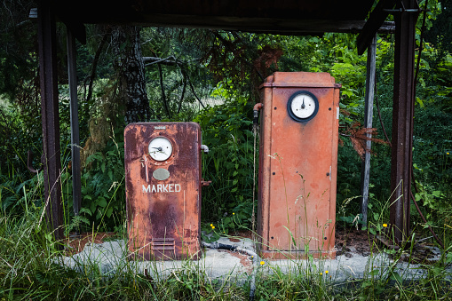 Antique gas pump at an abandoned gas station