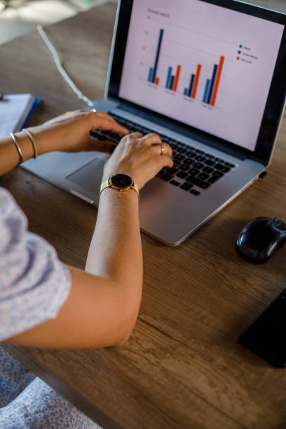 istock Female entrepreneur making a graph for a project she is working on 1410194457