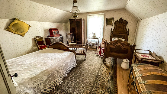 The Sedman house is one of the many houses that were moved from another location in the state of Montana to the historical recreated town of Nevada city Montana.  The original furnishings are decorating the bedroom of this house.