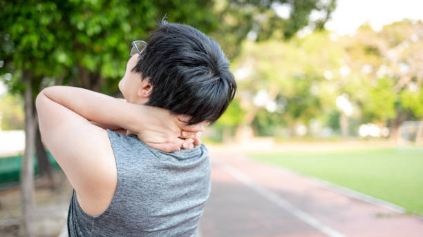 istock Asian athlete man with neck pain 1410196600