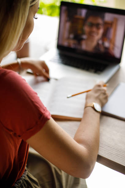 istock Young woman attending an online class while homeschooling 1410196993