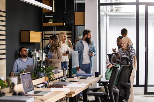 istock Diverse business colleagues chatting during coffee break at the office 1410201451