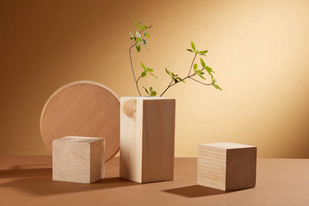 istock Wooden cube with green leaf decorated in brown background and blank space , abstract content 1410202171